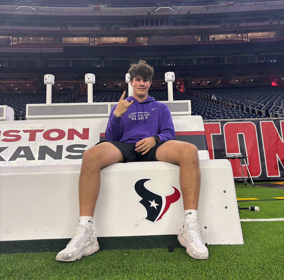 Jaeger sitting on a bench on the Houston Texans sideline