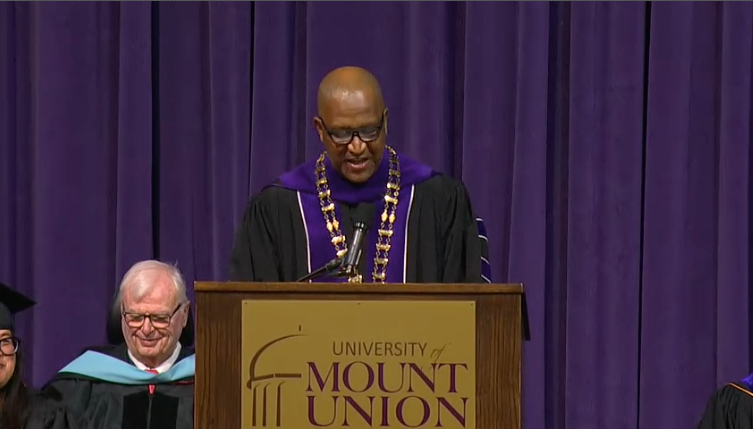 king speaking at podium