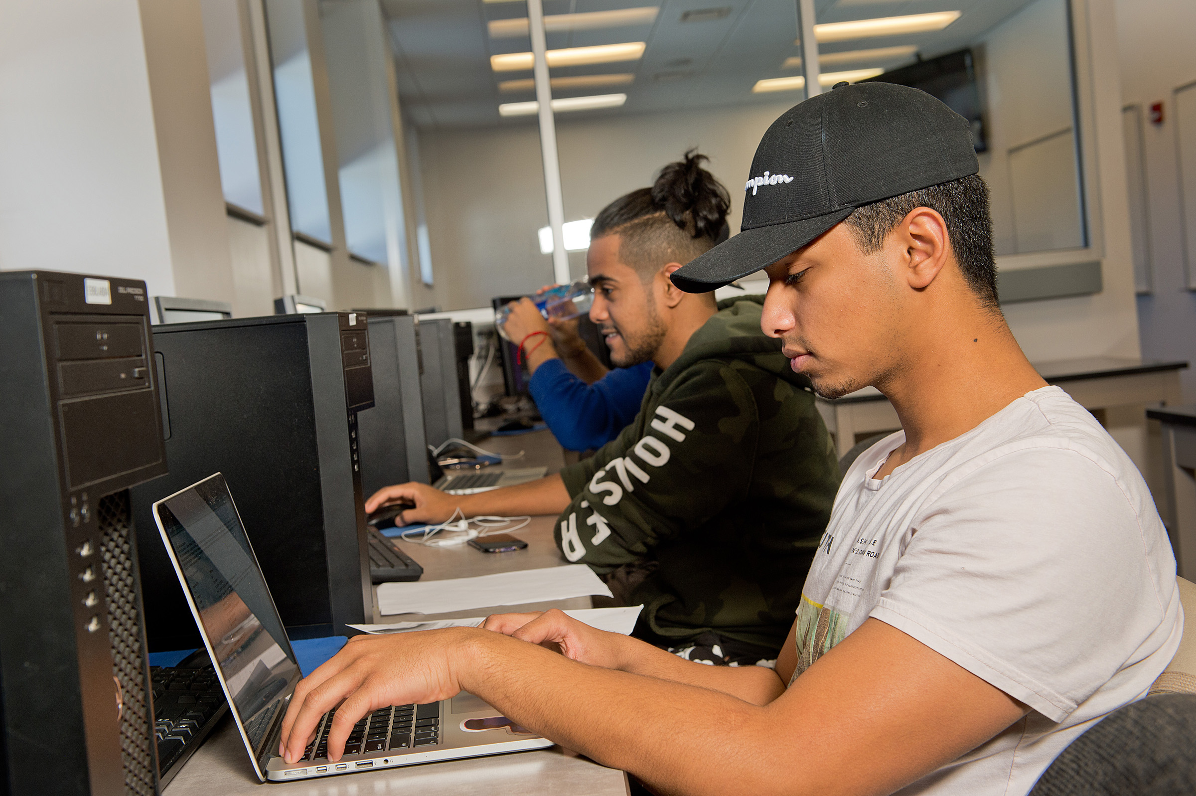 computer engineering students on laptops