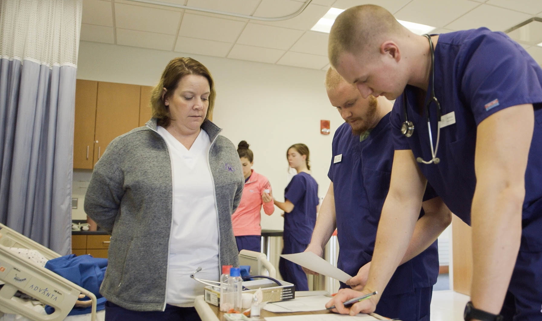 Nursing students working in lab