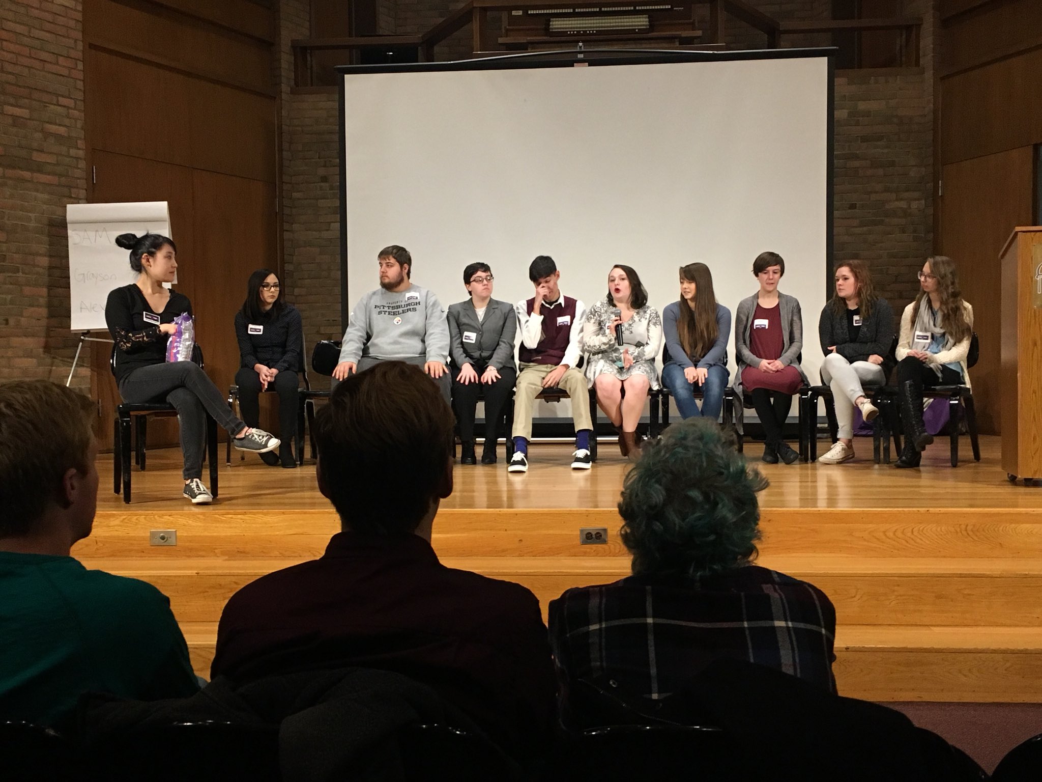 people sitting on panel discussion