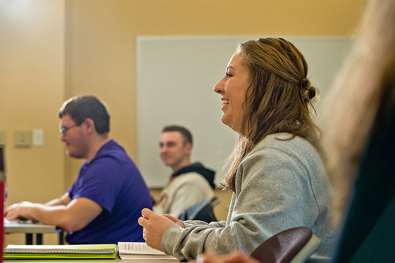 student smiling in classroom