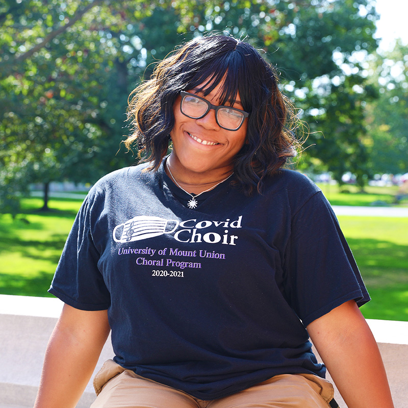 aaliyah kinnard sitting on bench