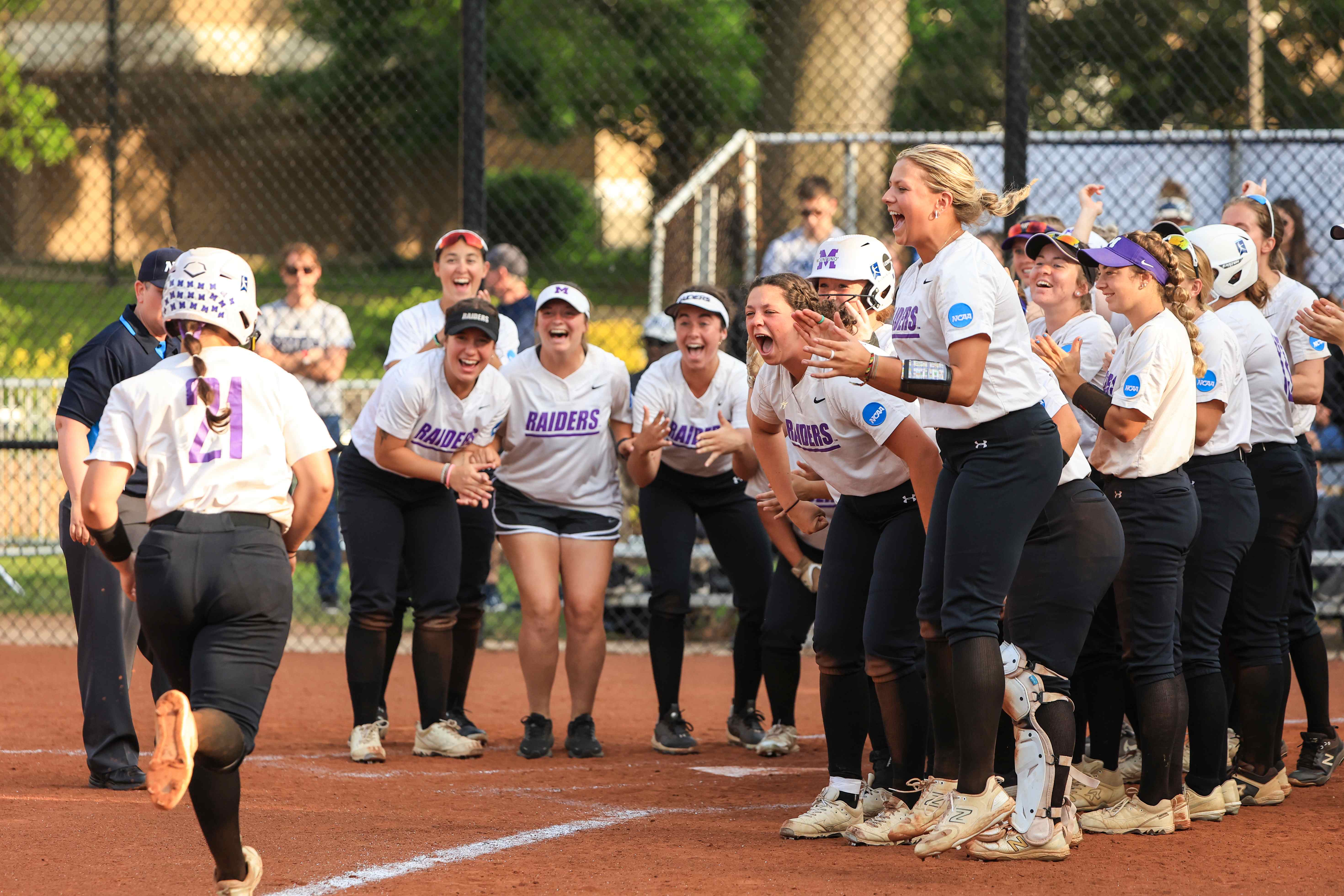 softball team celebrating